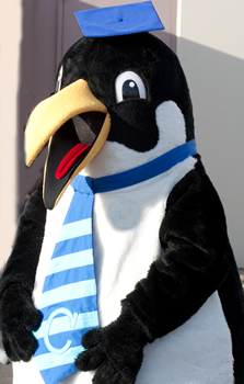 Clark's penguin mascot Oswald at commencement