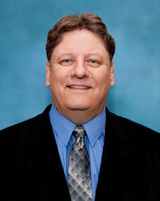 Associate head softball coach Ted Buck