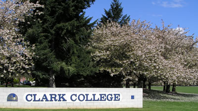 Cherry trees and Clark College sign