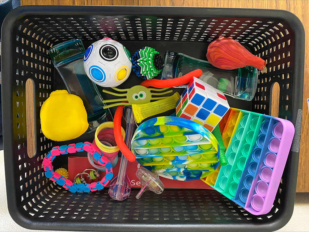 Basket of fidgets for added tactile engagement.