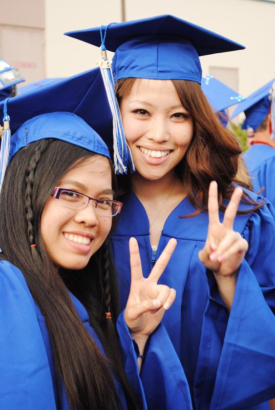 Two female students at graduation
