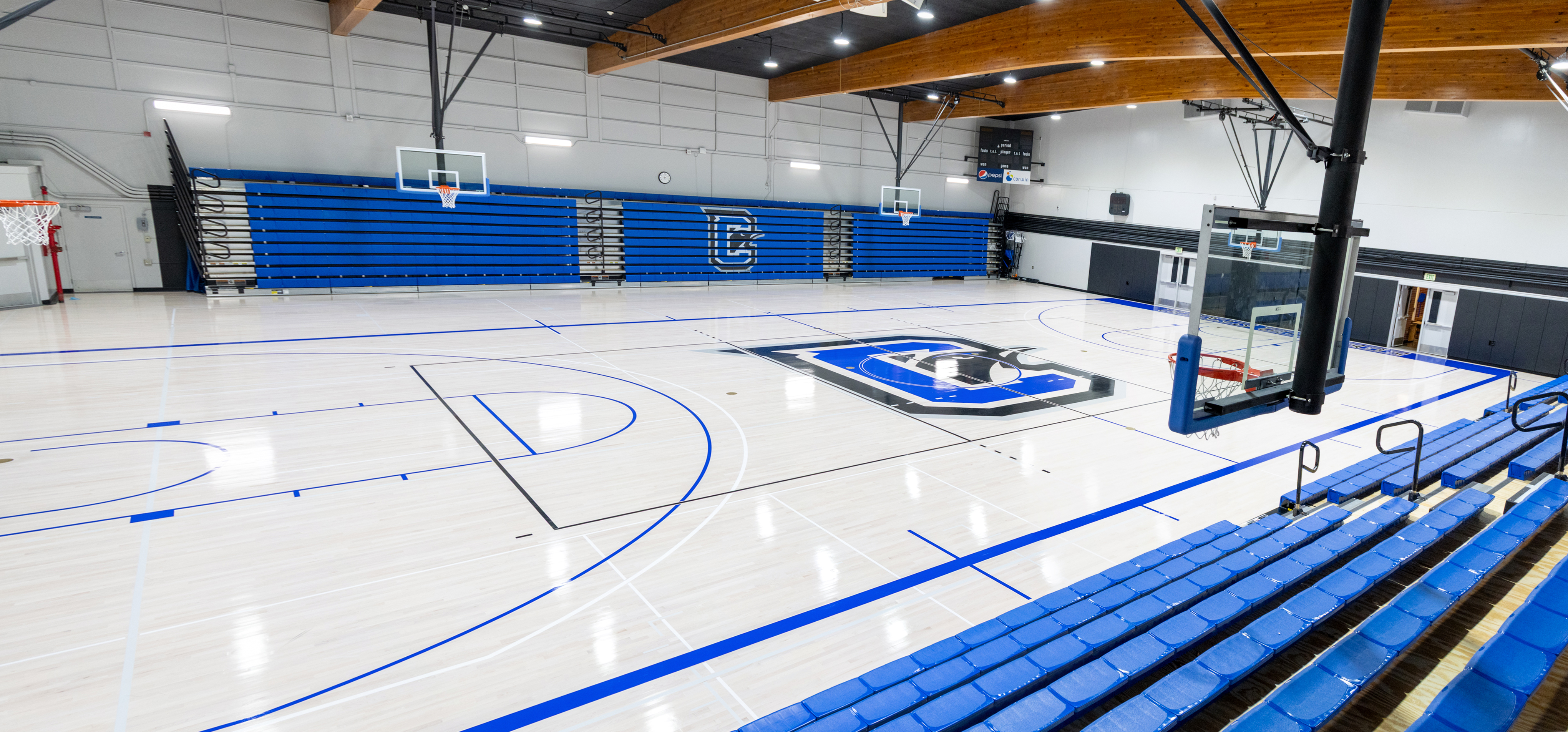 photo of Gym with basketball hoops and bleachers