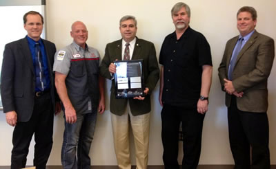 Left to right: Rick Lester, Technician Development Manager at Toyota Motor Sales USA; Clark College automotive technology instructor Jason Crone; Clark College President Bob Knight; Clark College automotive technology professor Mike Godson and Andrew Passage, T-TEN Area Manager. 