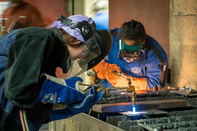 A Clark student welding