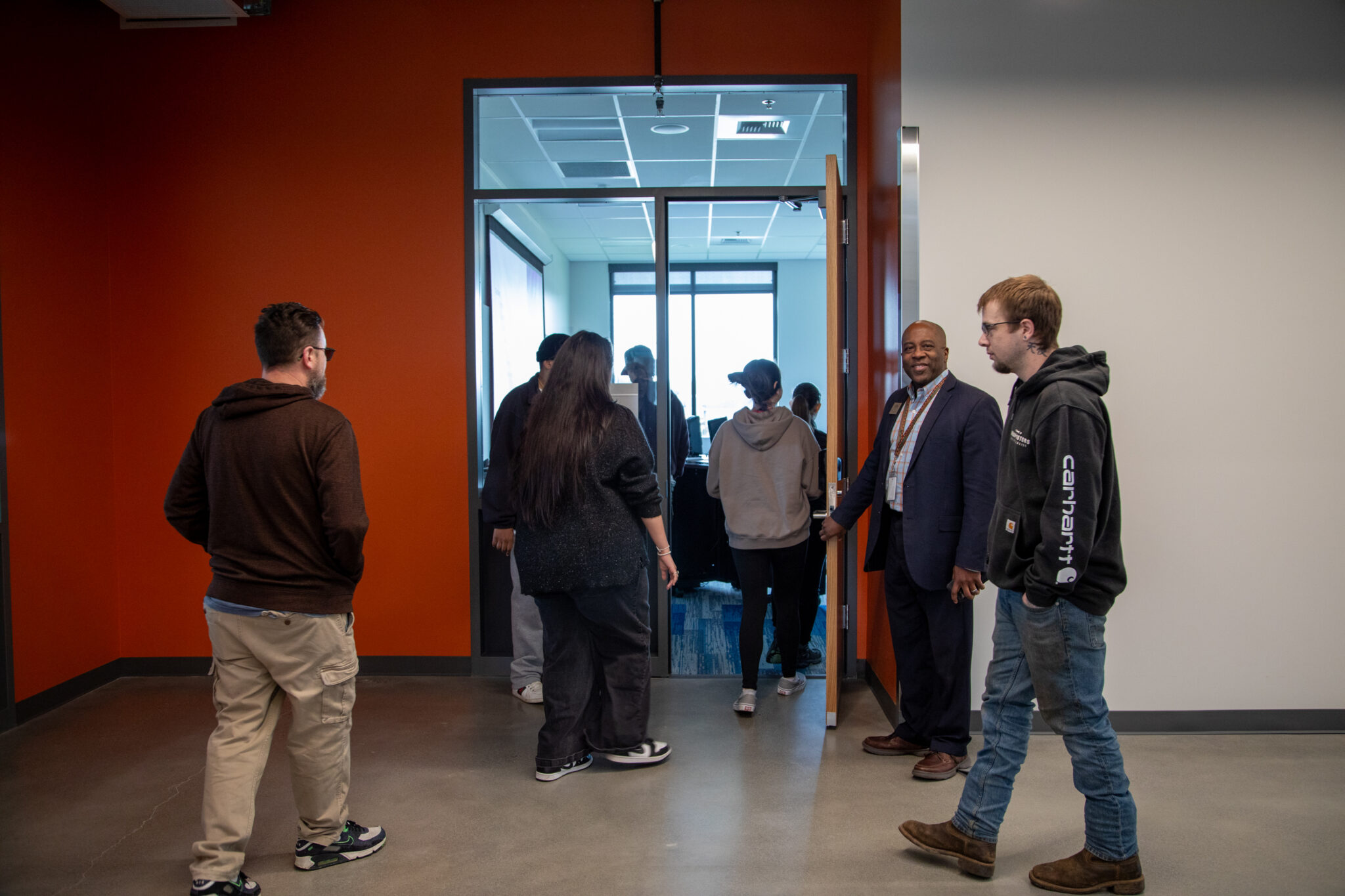 people walking through doorway