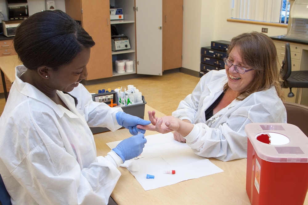 phlebotomy student practicing in a health care environment