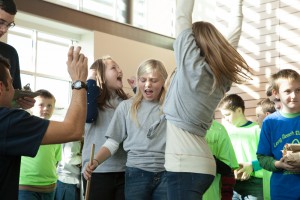 Students from Eisenhower Elementary celebrate an unbroken egg after testing