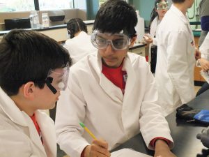 kids with safety goggles on at Science Olympiad