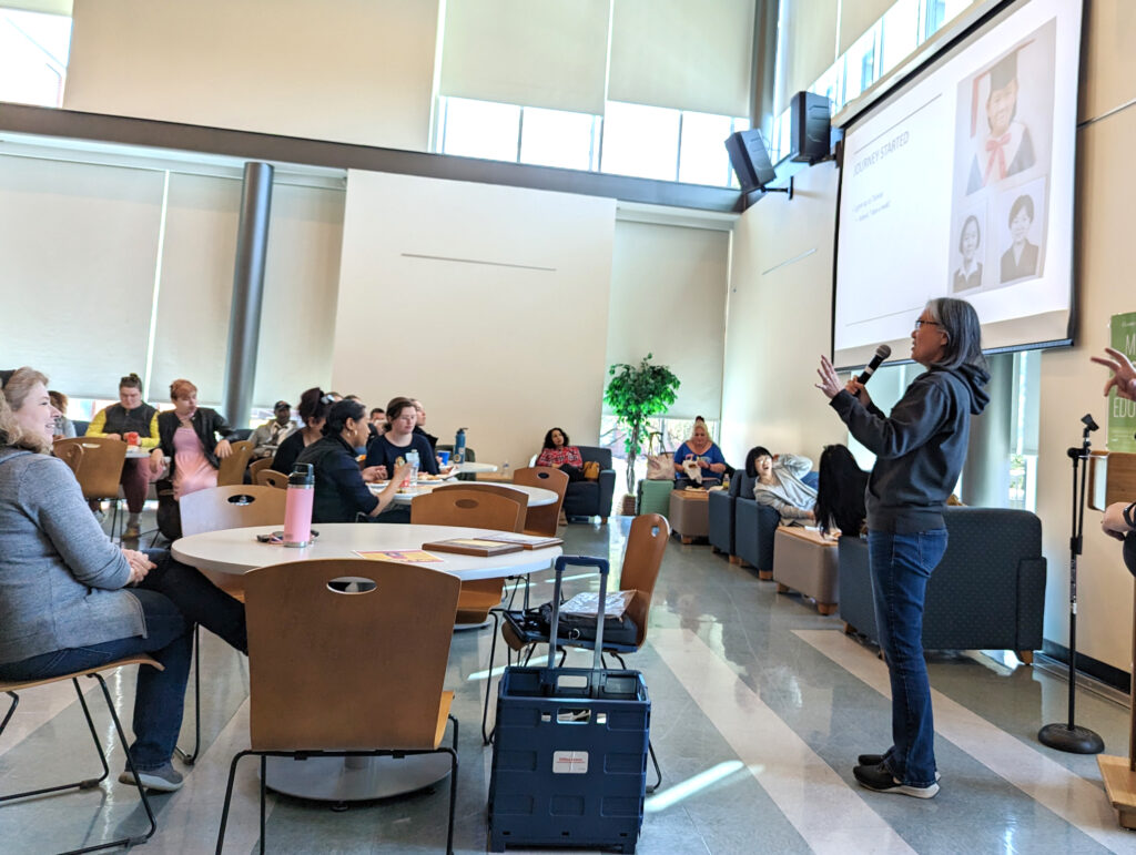 Carol Hsu speaks to the luncheon audience