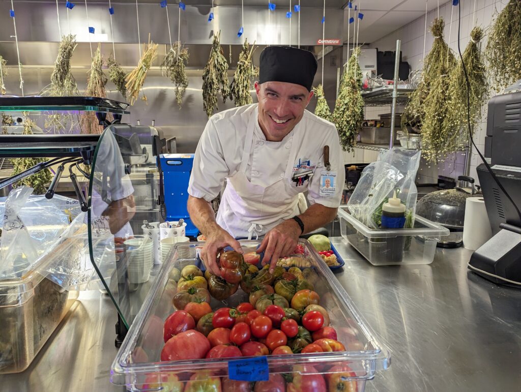 Chef Sonny shows KGW-TV the produce he harvested from the garden on the first day of fall term.