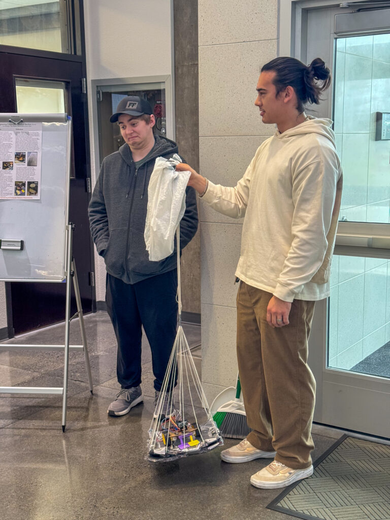 students holding project