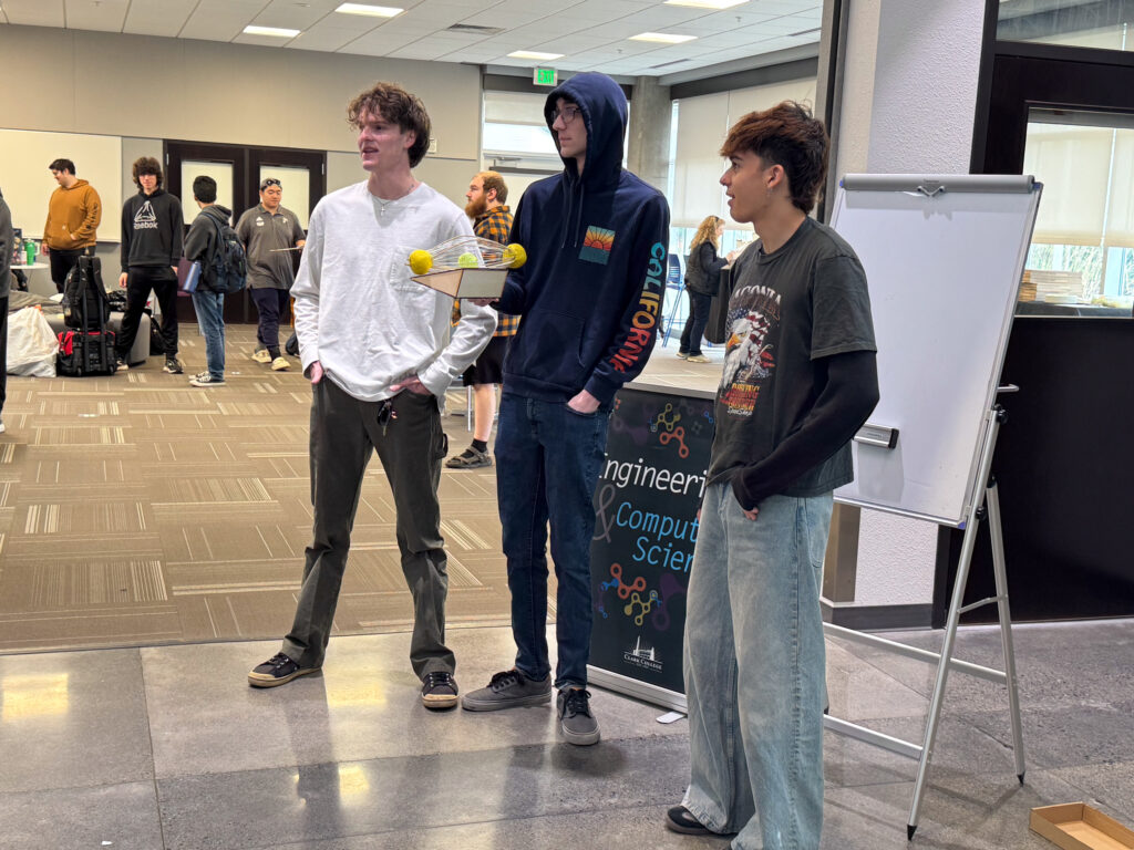 students holding project
