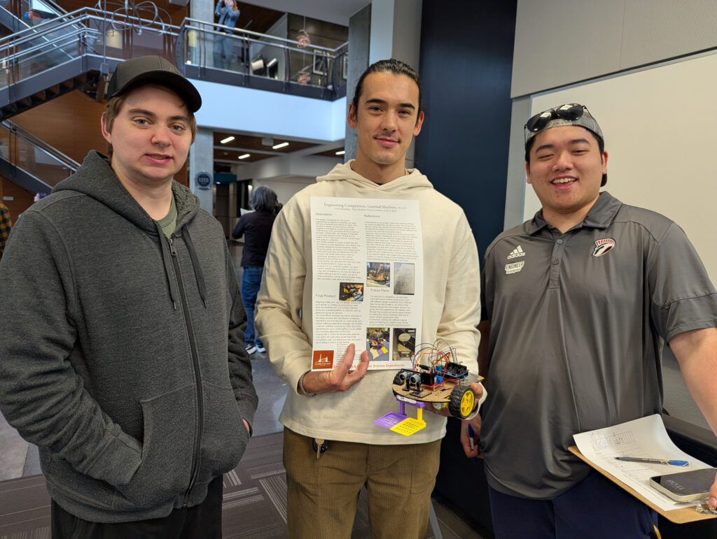 students holding project