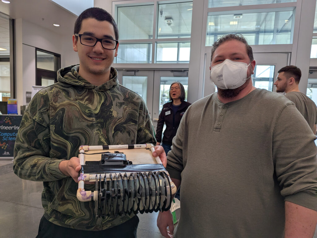 students holding project