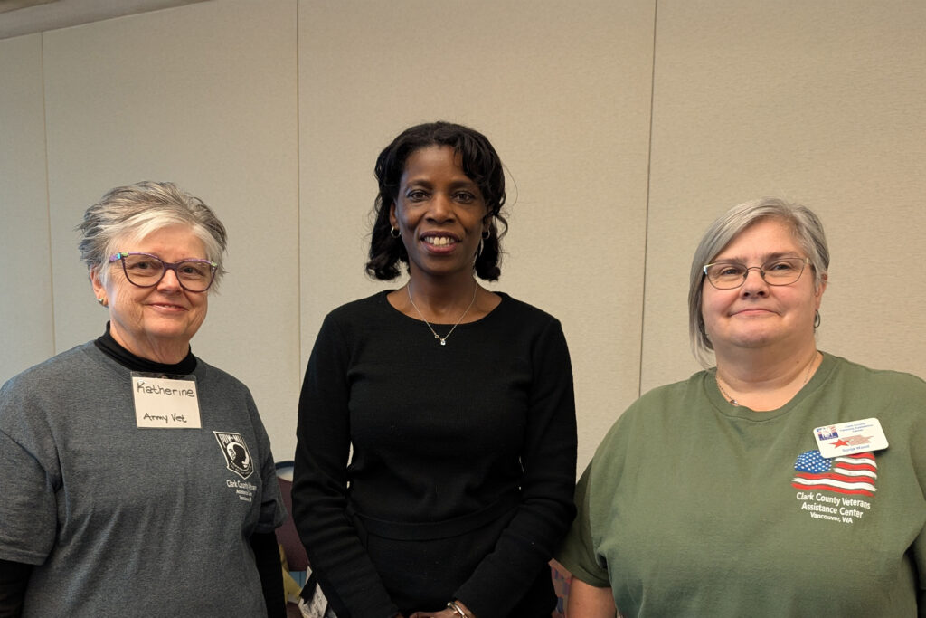 three people looking at camera