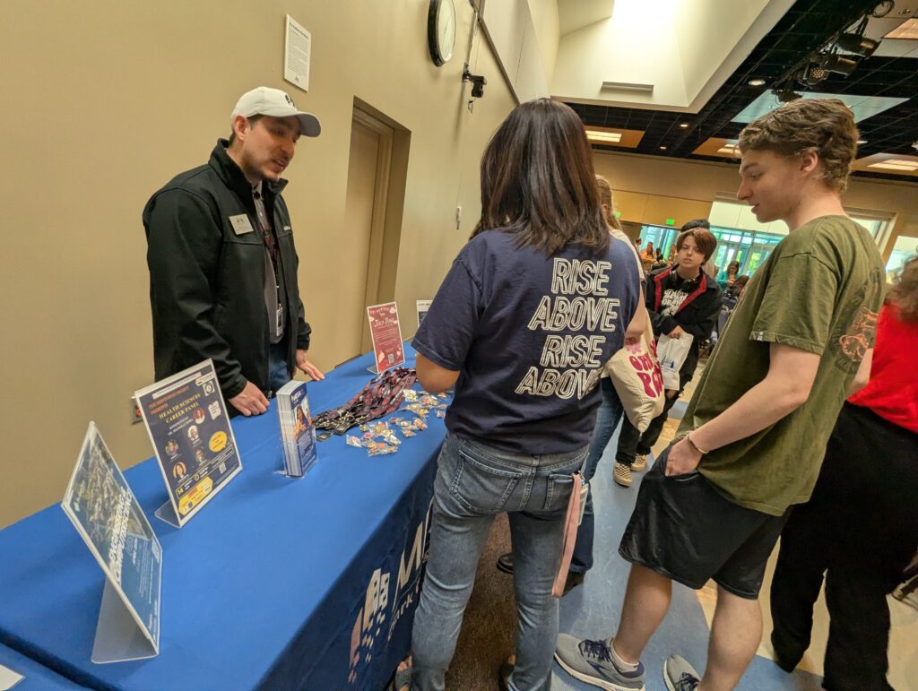 people at information table