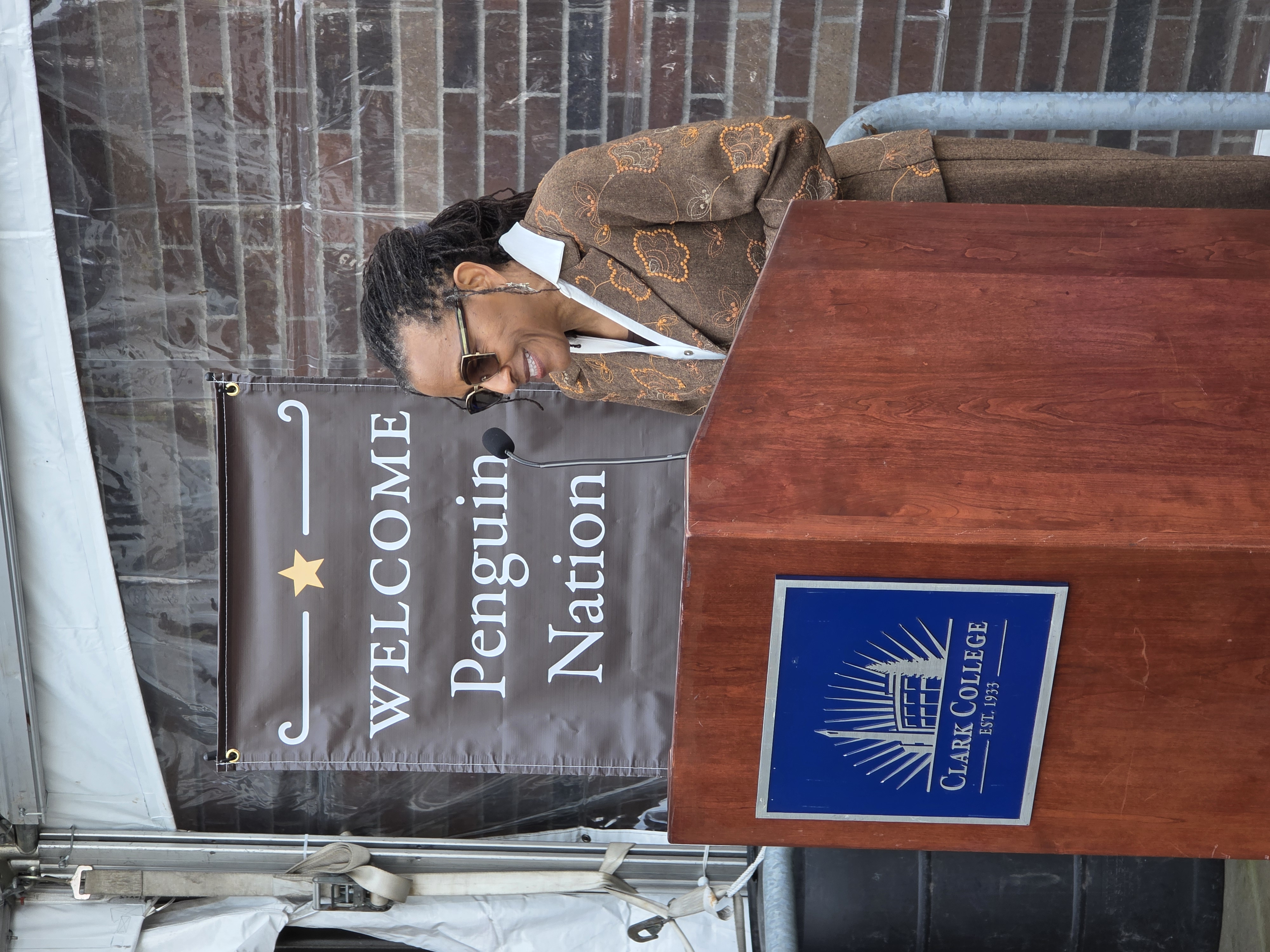 Board of Trustees Chair Marilee Scarbrough speaks at a podium