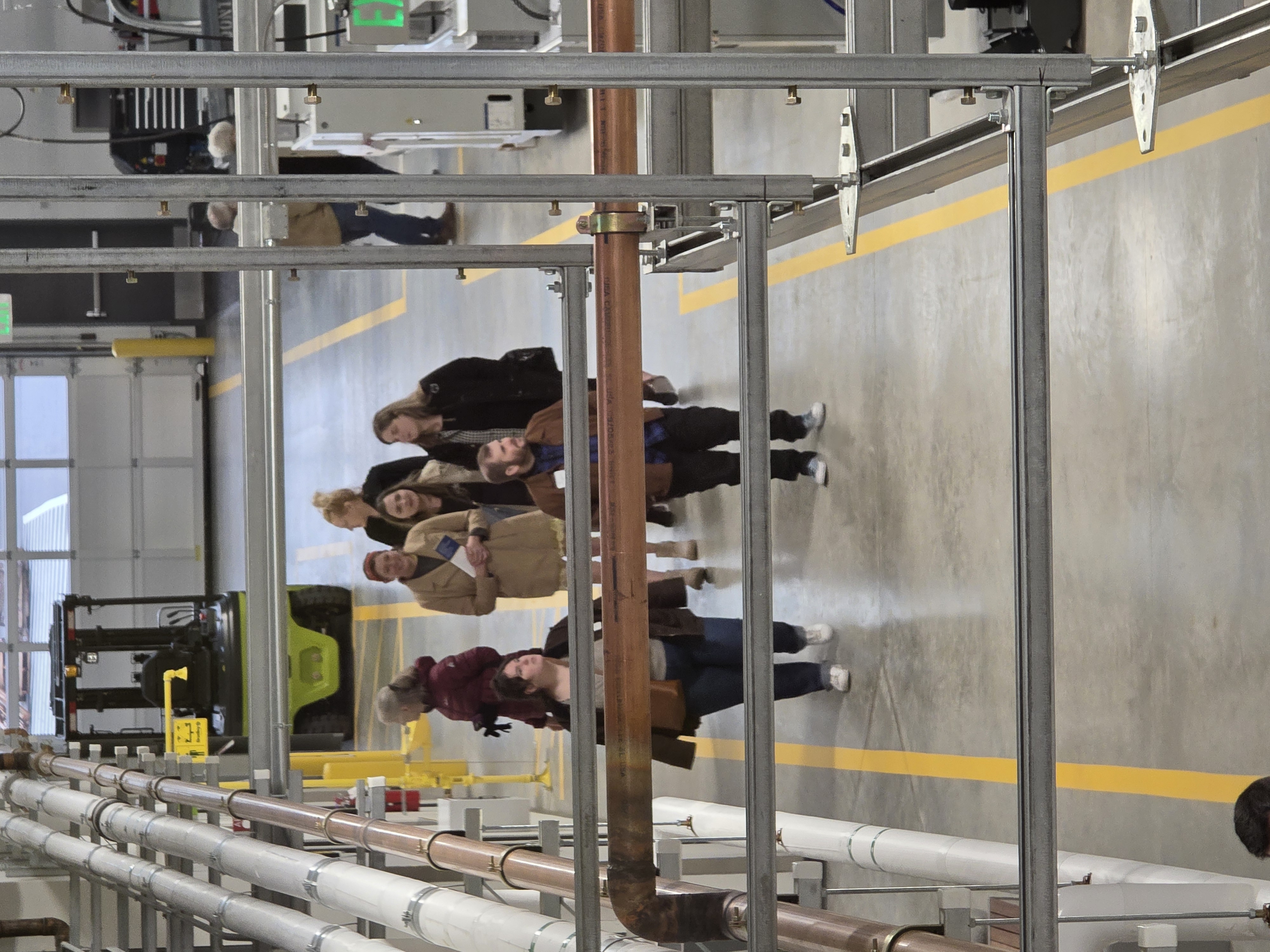 A group of event attendees walk through Clark College's AMC
