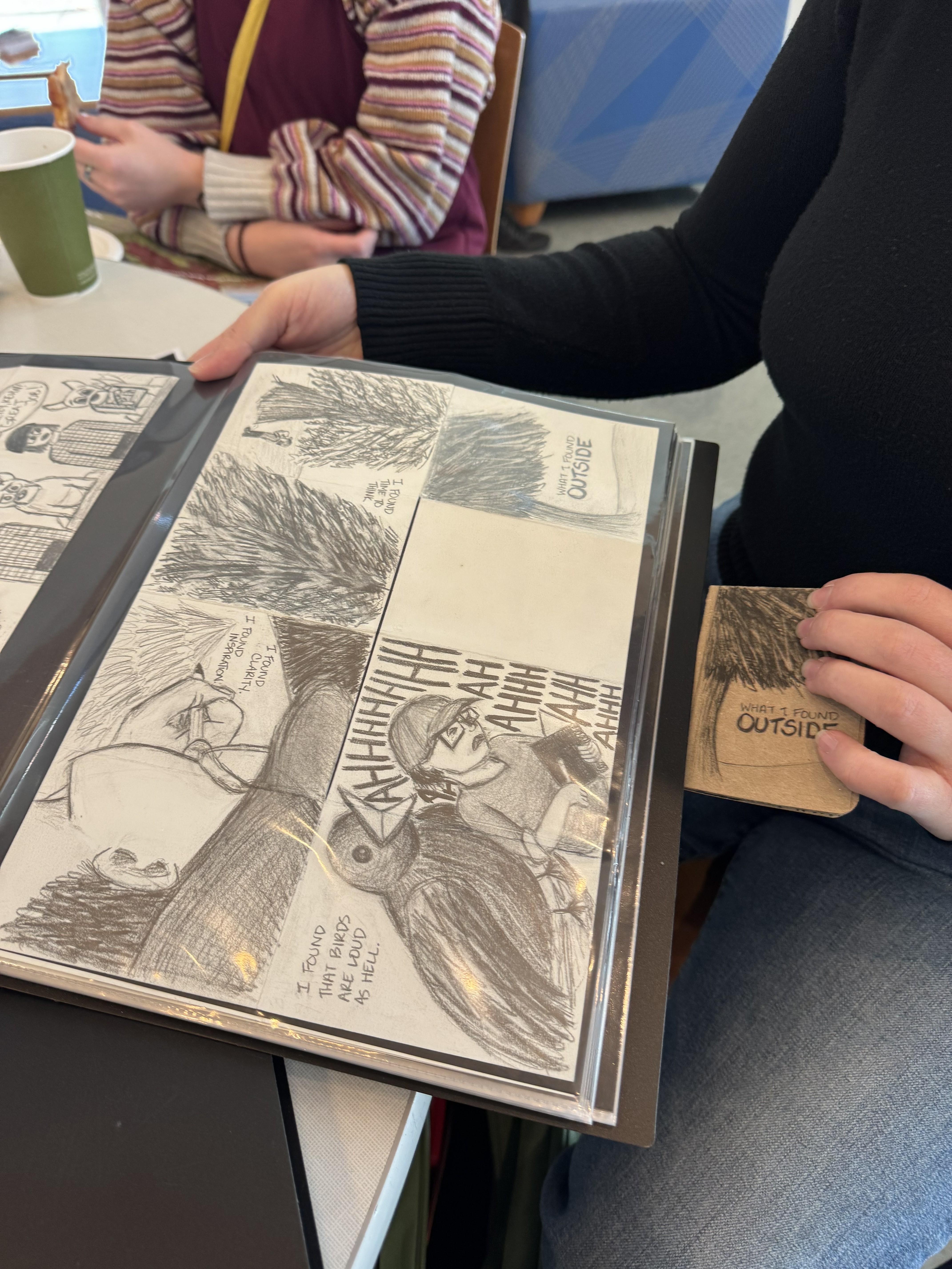 Lindsey Bross's original drawing next to a finished zine