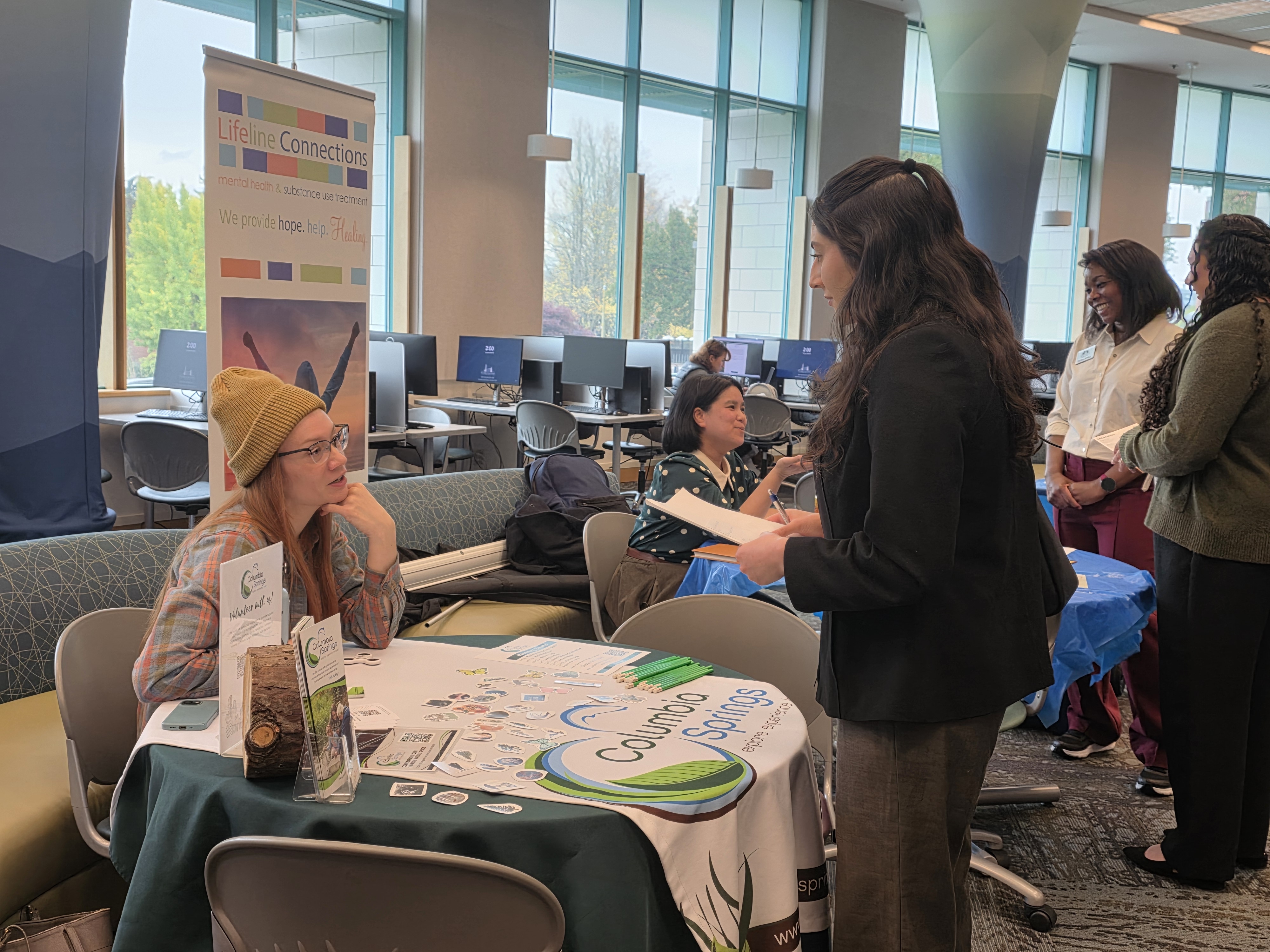 Student talking to an industry professional