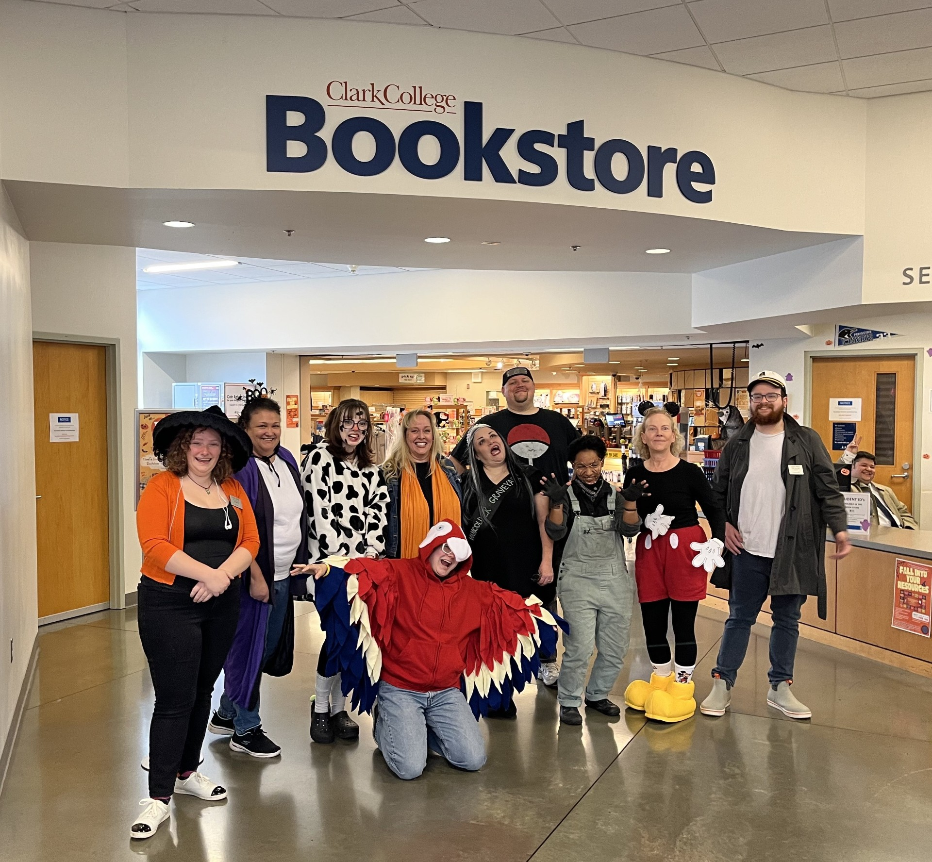 Group of employees in costume in front of the bookstore