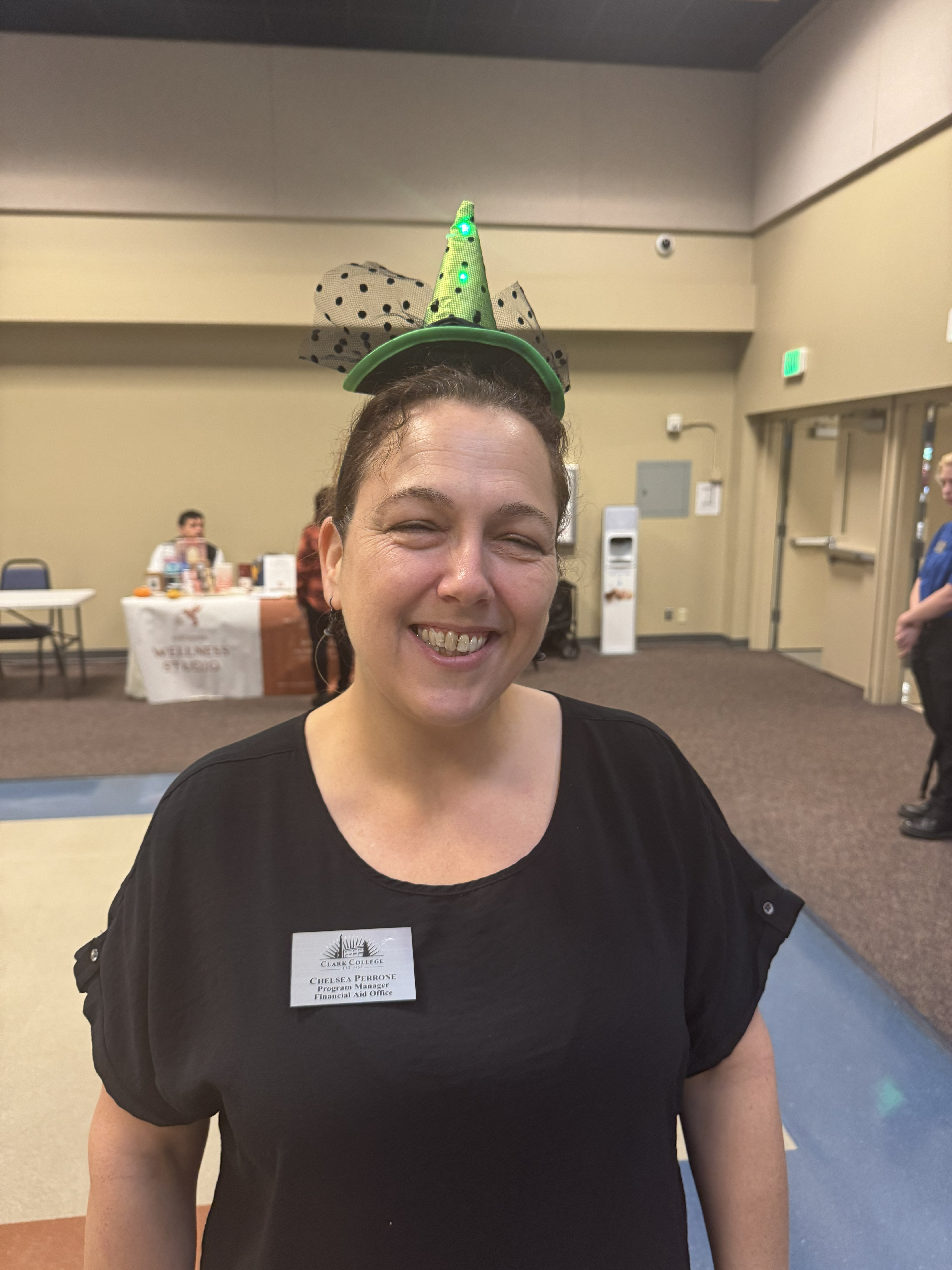 Chelsea Perrone in a green witch hat