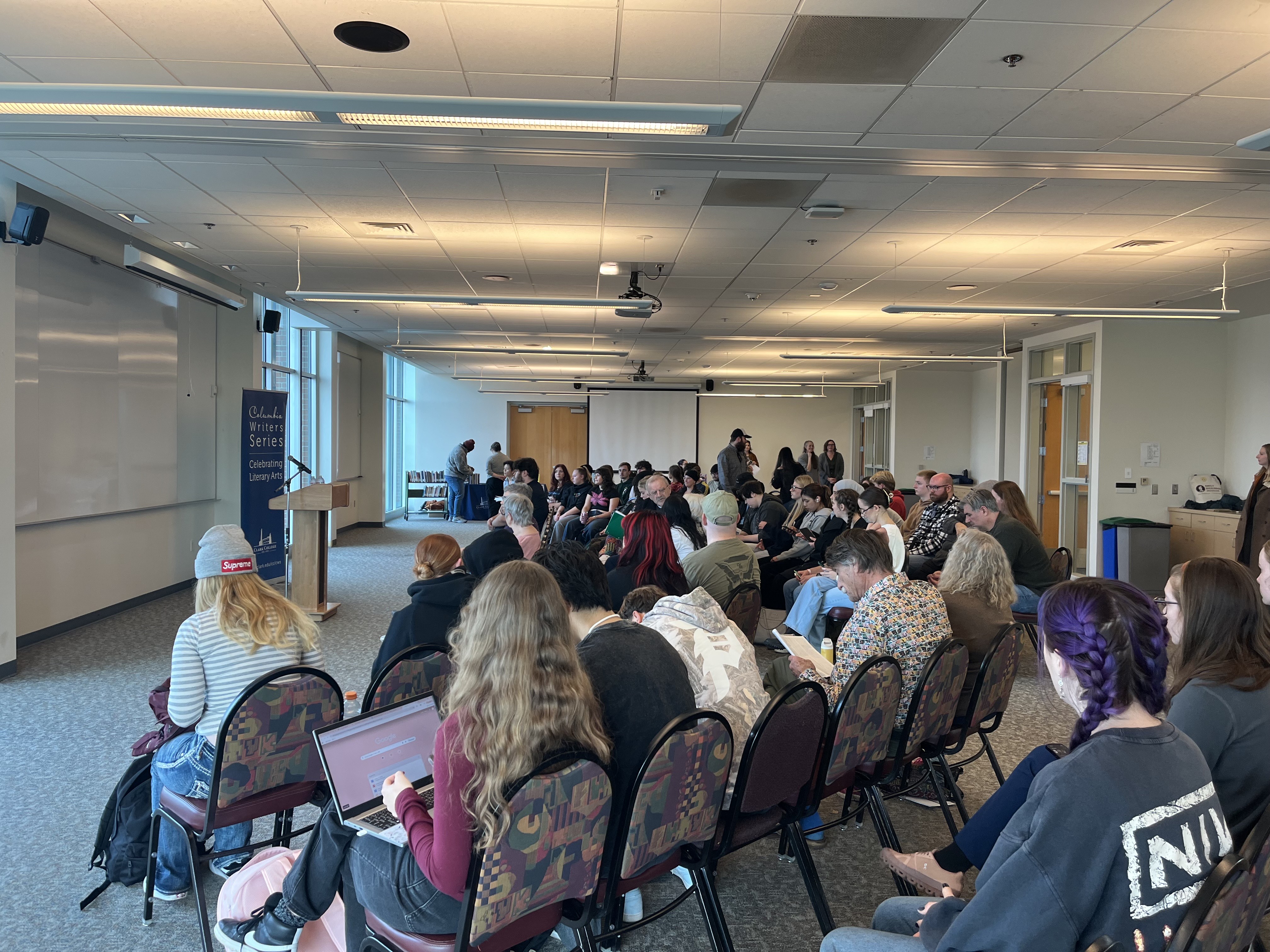 A packed audience awaits poet Danez Smith