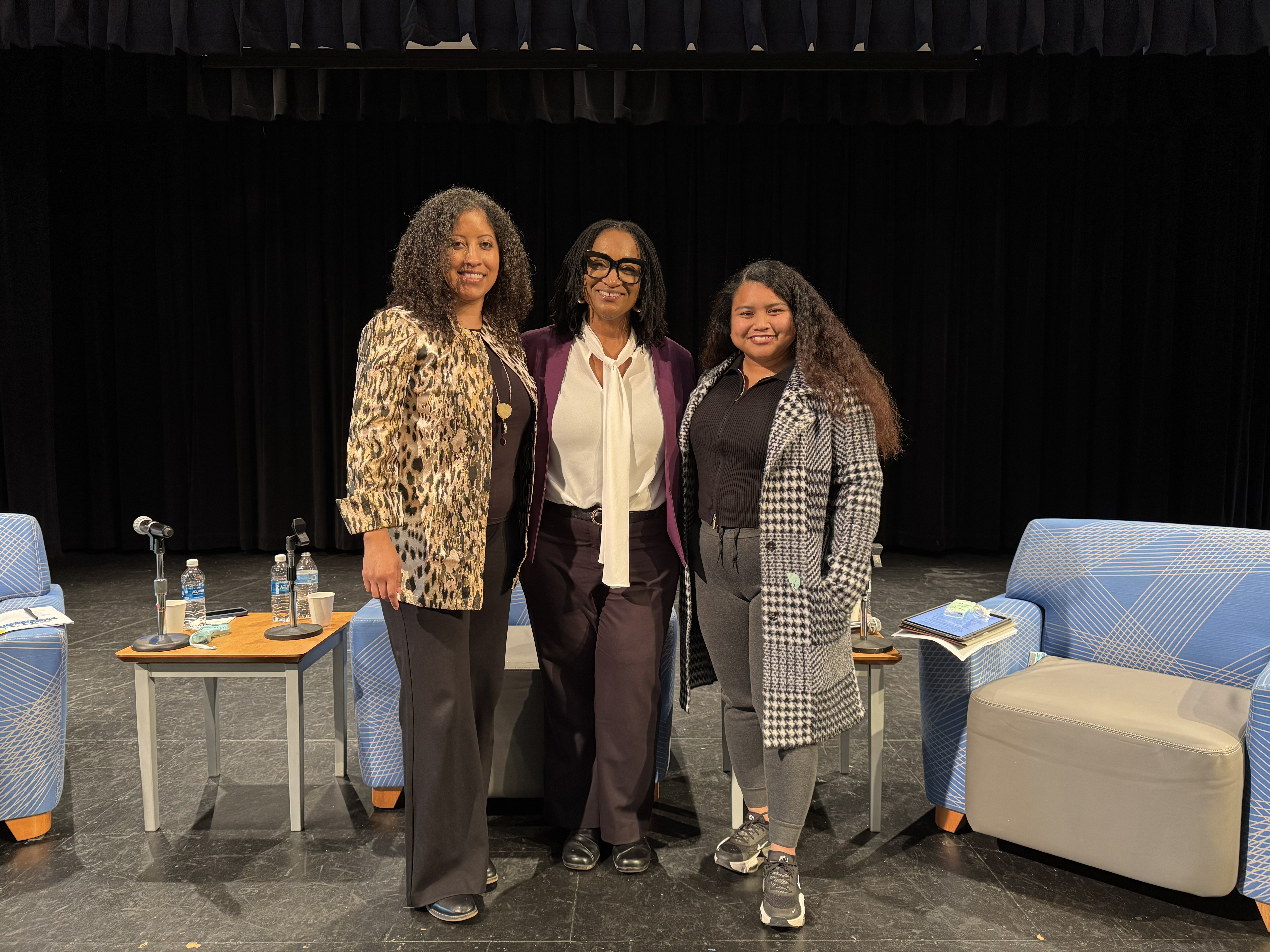 Vanessa Neal, Sesany Fennie-Jones, and Gemma Somol standing together on a stage