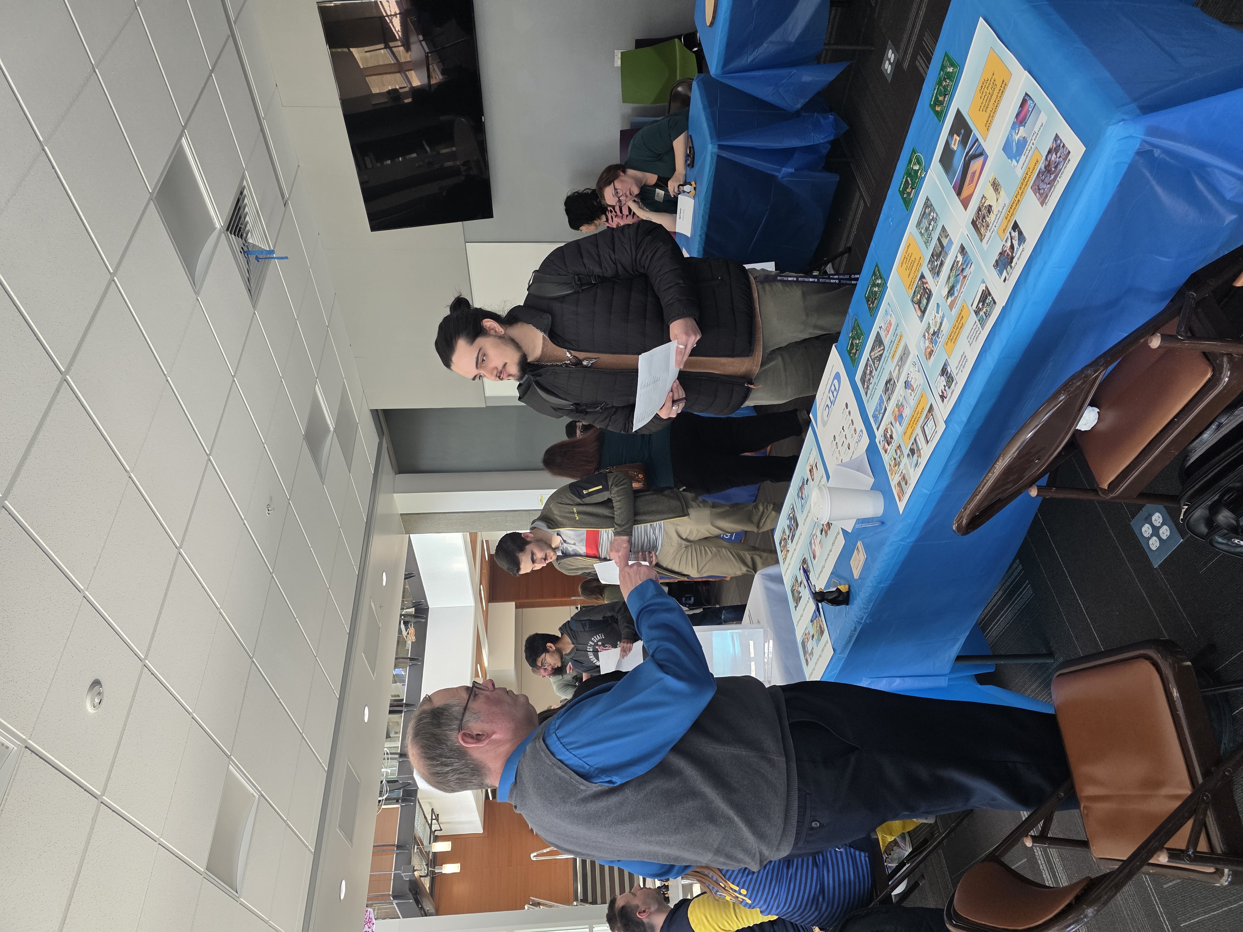 STEM student Seth speaks to a vendor at a Career Connect event held in the STEM building.