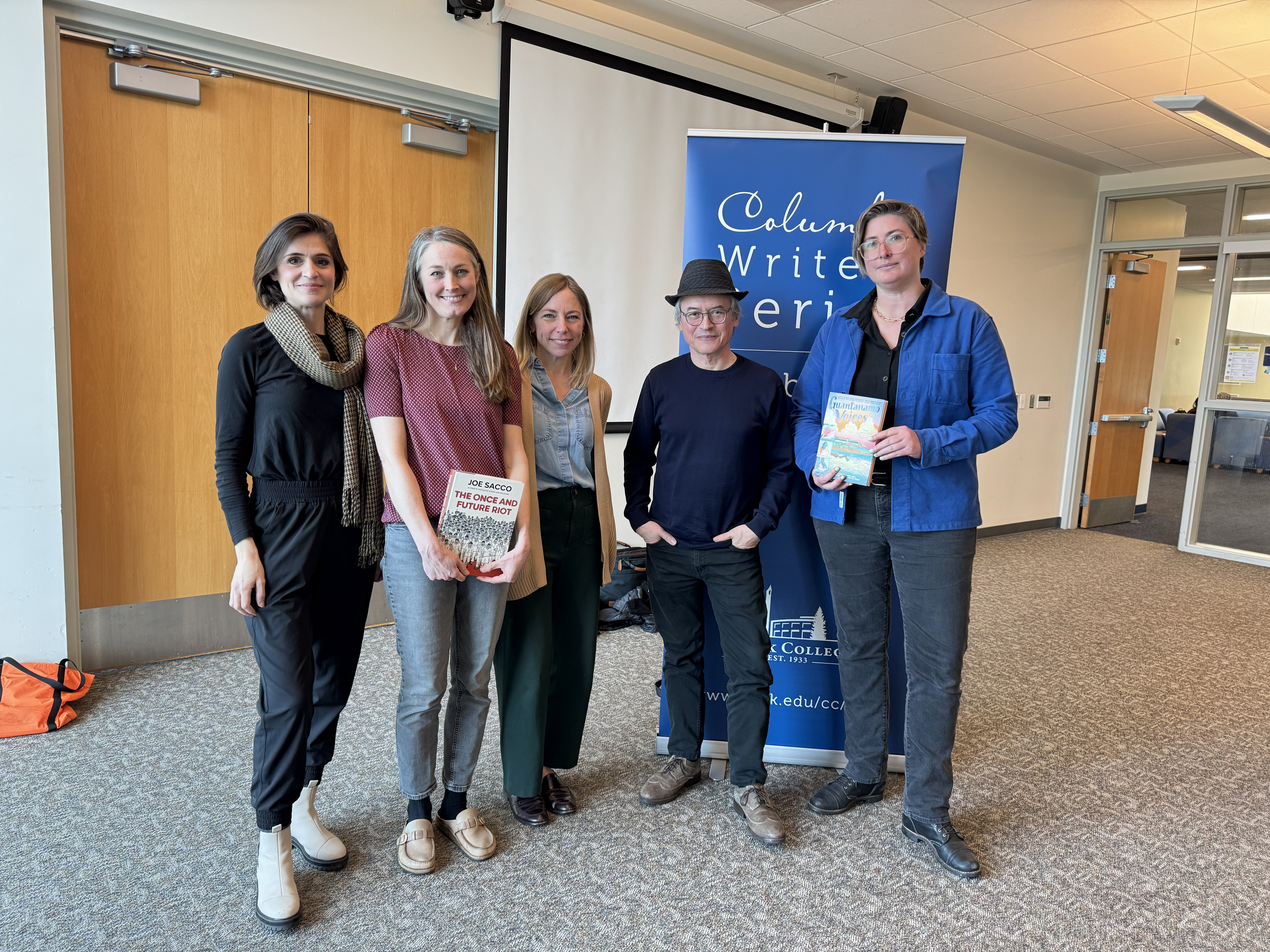 Comic writer Joe Sacco standing with CWS coordinators and local artist Sarah Shay Mirk