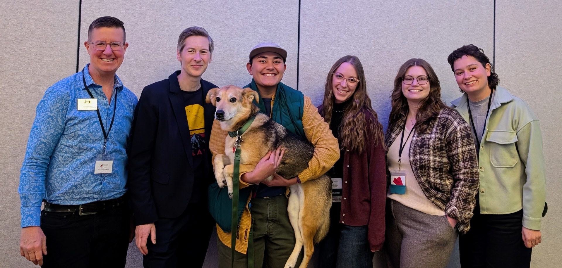 Cath Busha, Dr. Sue Orchard, Caitlin Malvar holding Oso, Pearl Brown, Meagan Montalto, and Phoebe Cordova