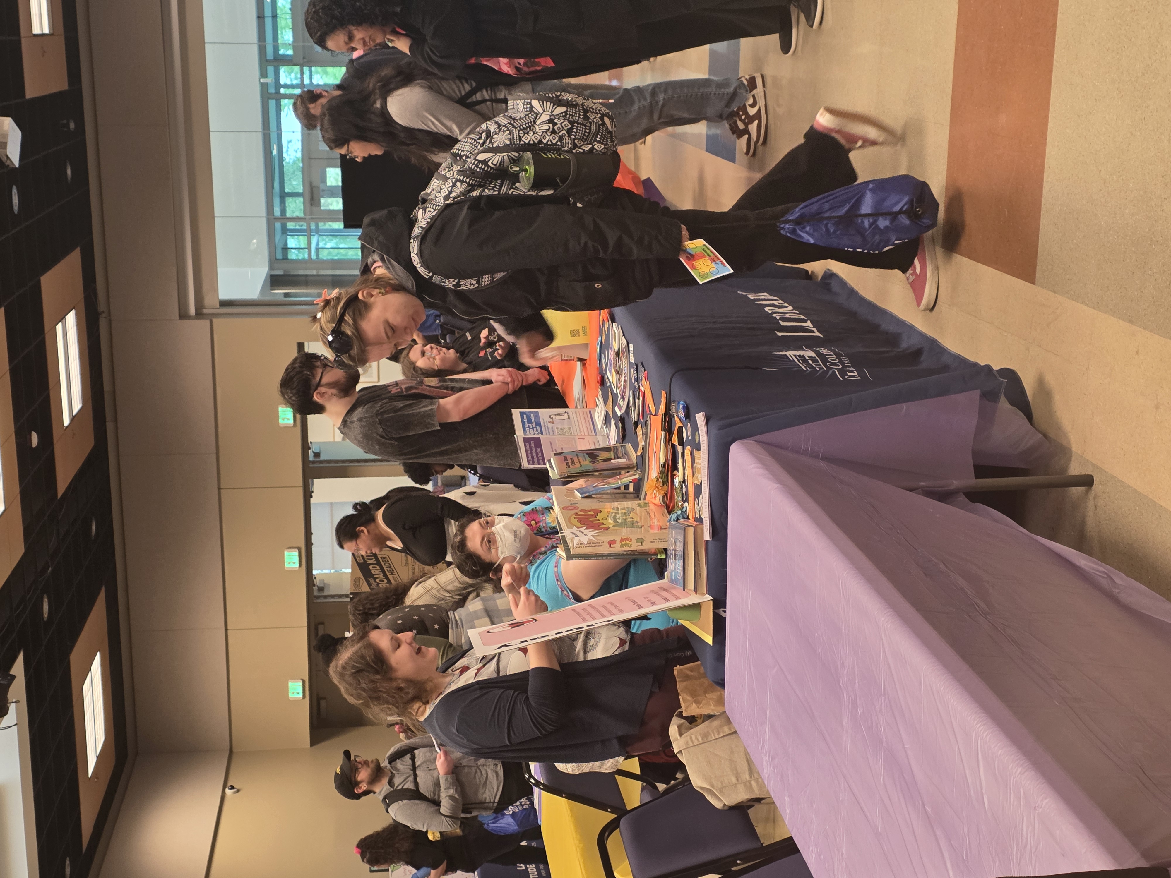 Students speaking at a booth at Student Involvement Fair