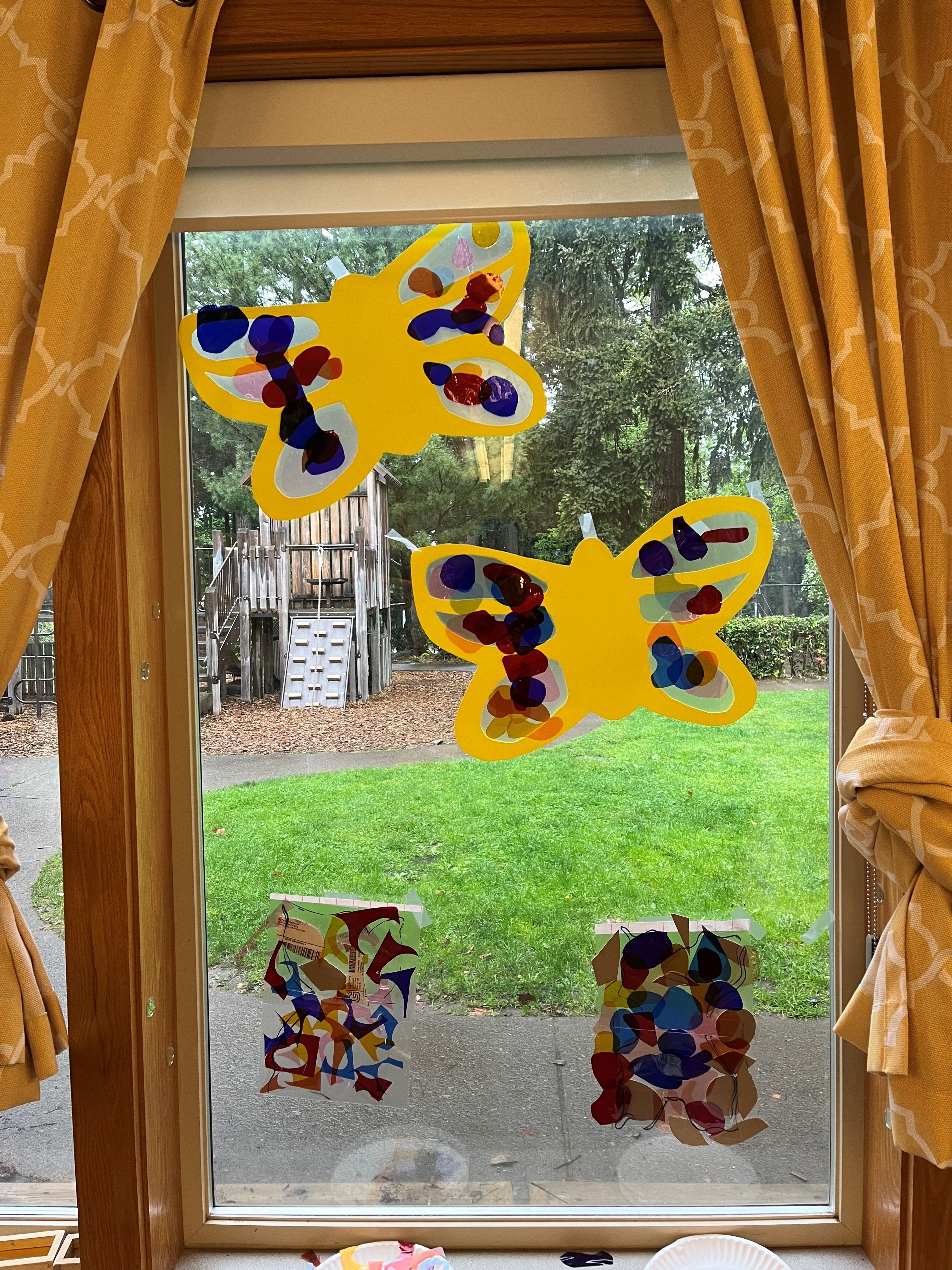 Paper butterflies on a window