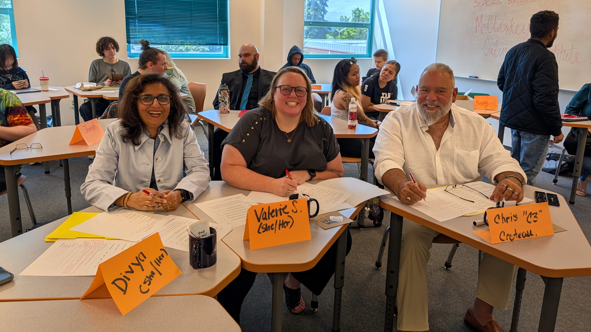 Judges sitting at a table in a classroom