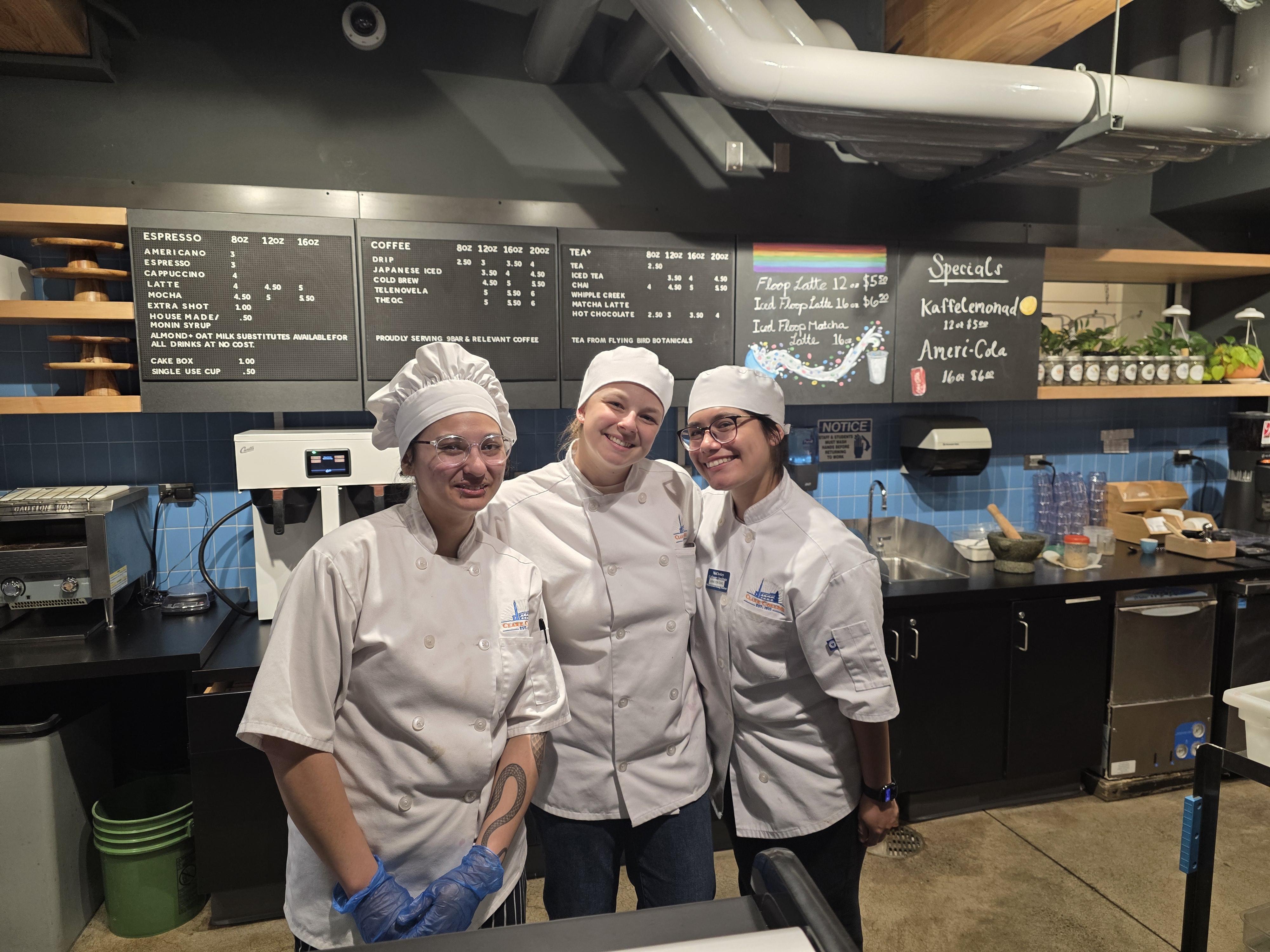 Culinary students behind counter at cafe, where they were creating non-alcoholic cocktails