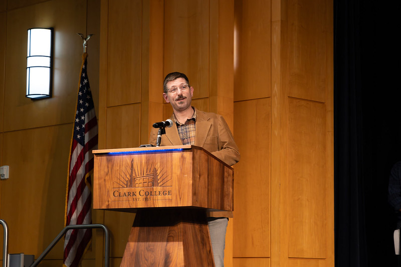 Kevin Edwards speaking at the podium during tenure reception