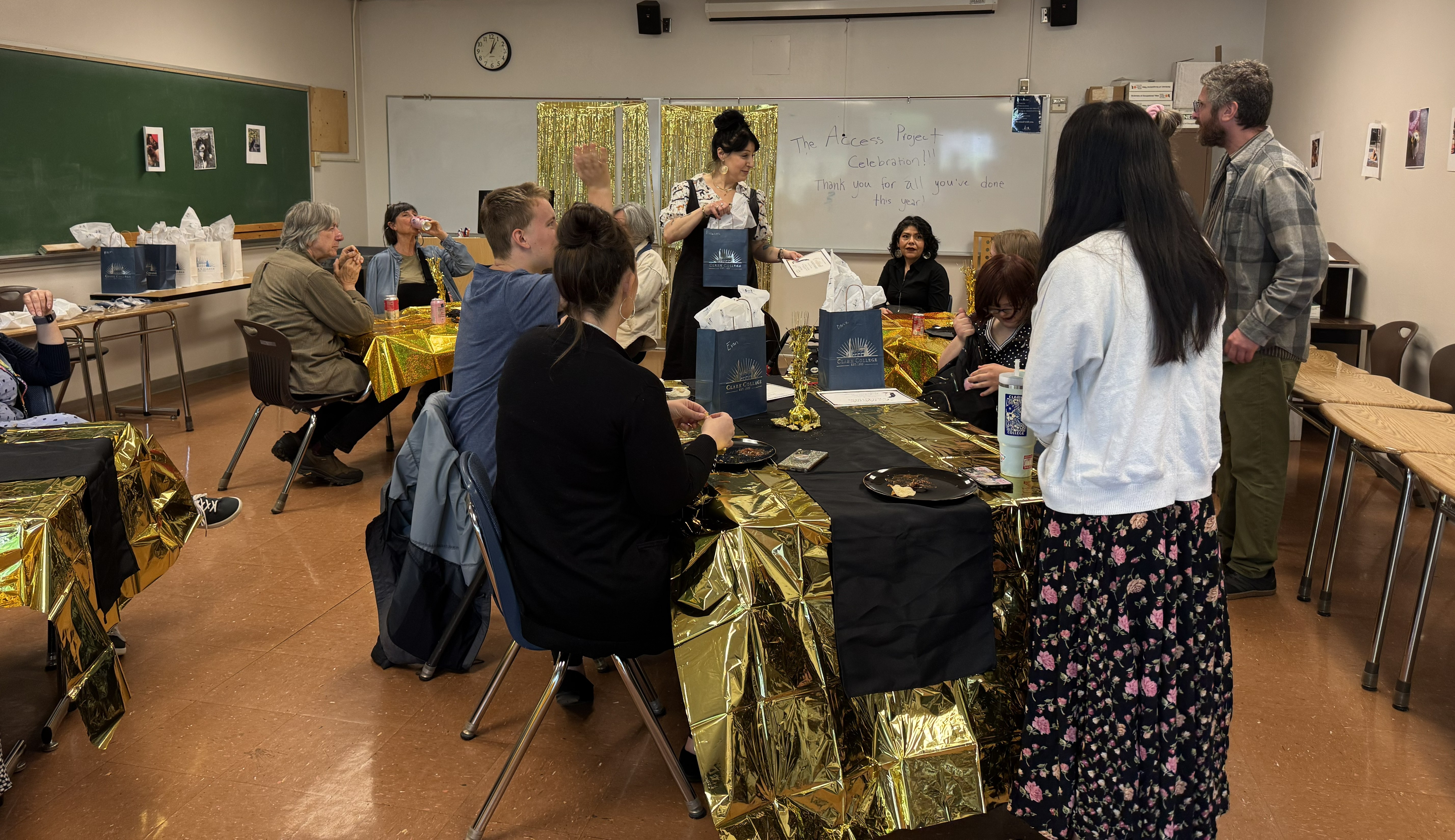 Participants of the Access Project celebrating in a classroom