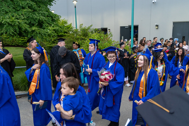 Graduates walk out of the ampitheatre