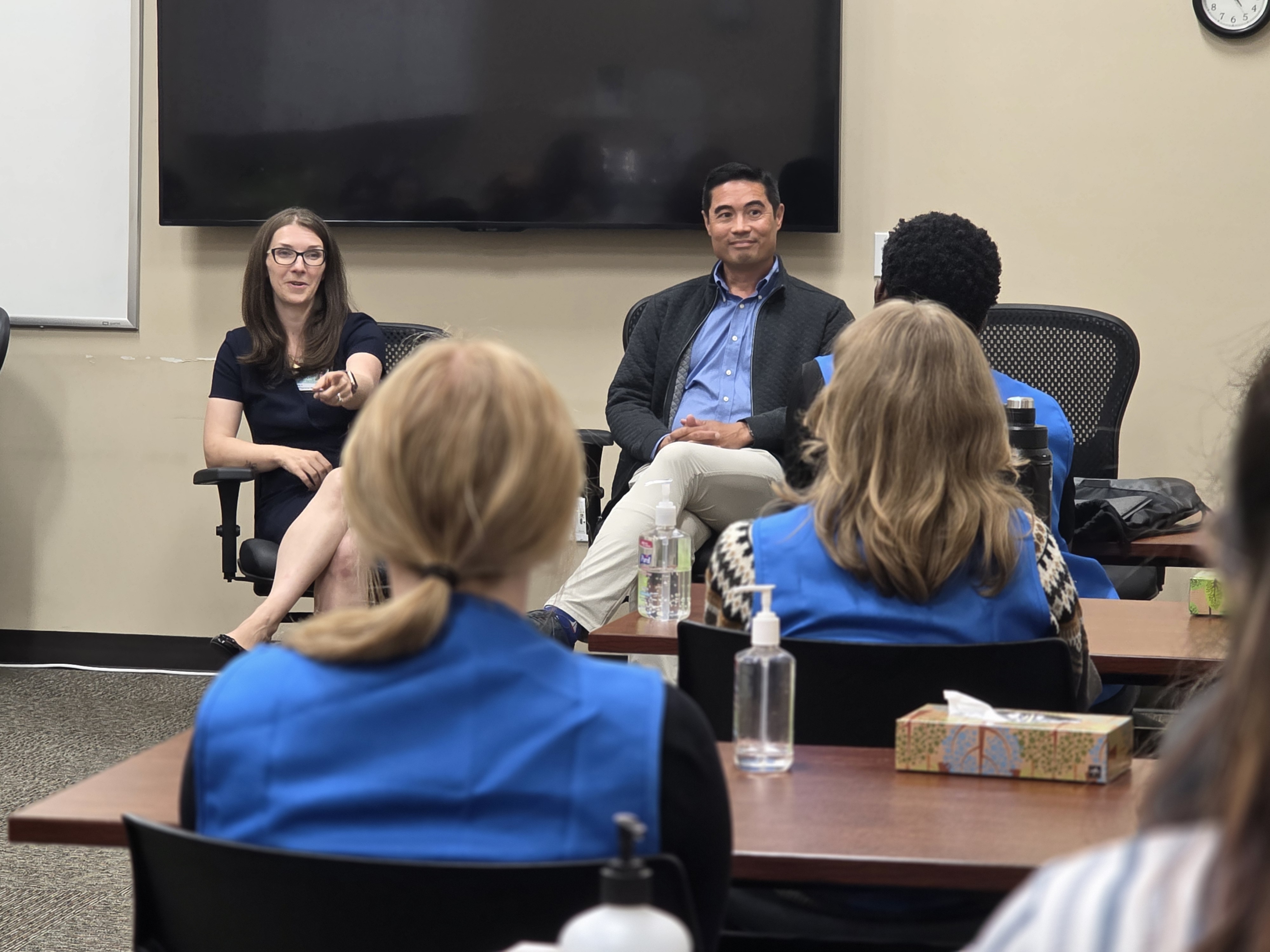 Shay Miller and Dr. Erik Geissal interacting with students during a panel