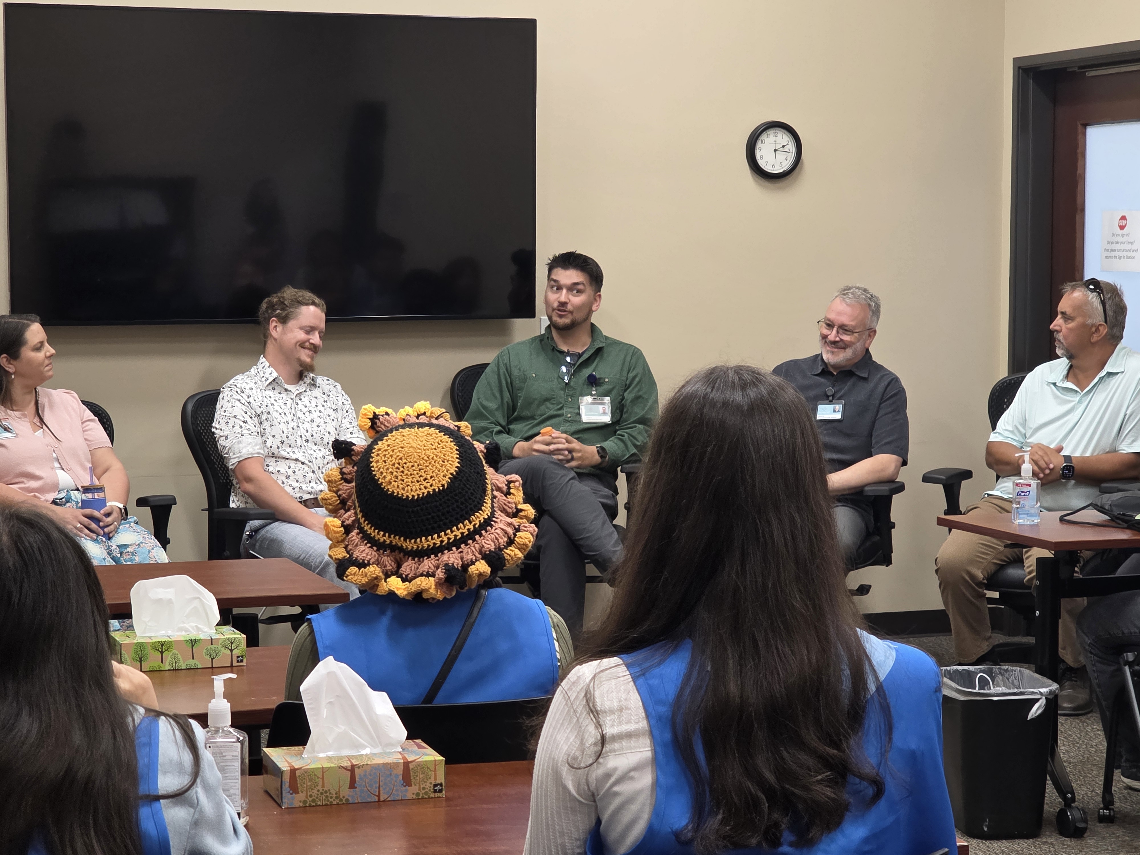 A panel of medical professionals speaking with a classroom of students