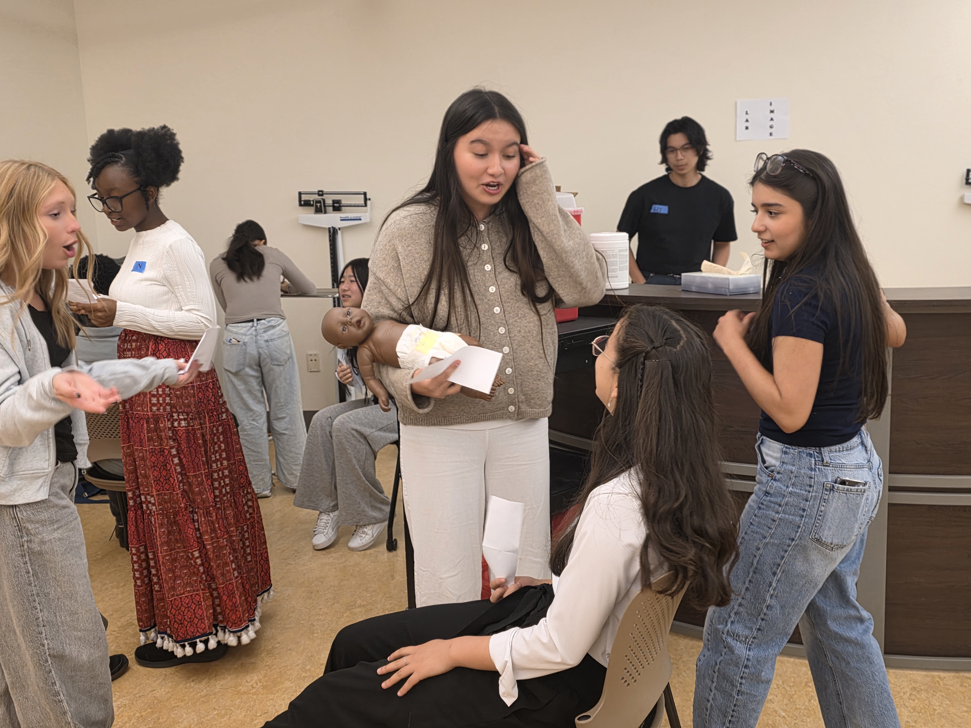 Students participate in an emergency room simulation
