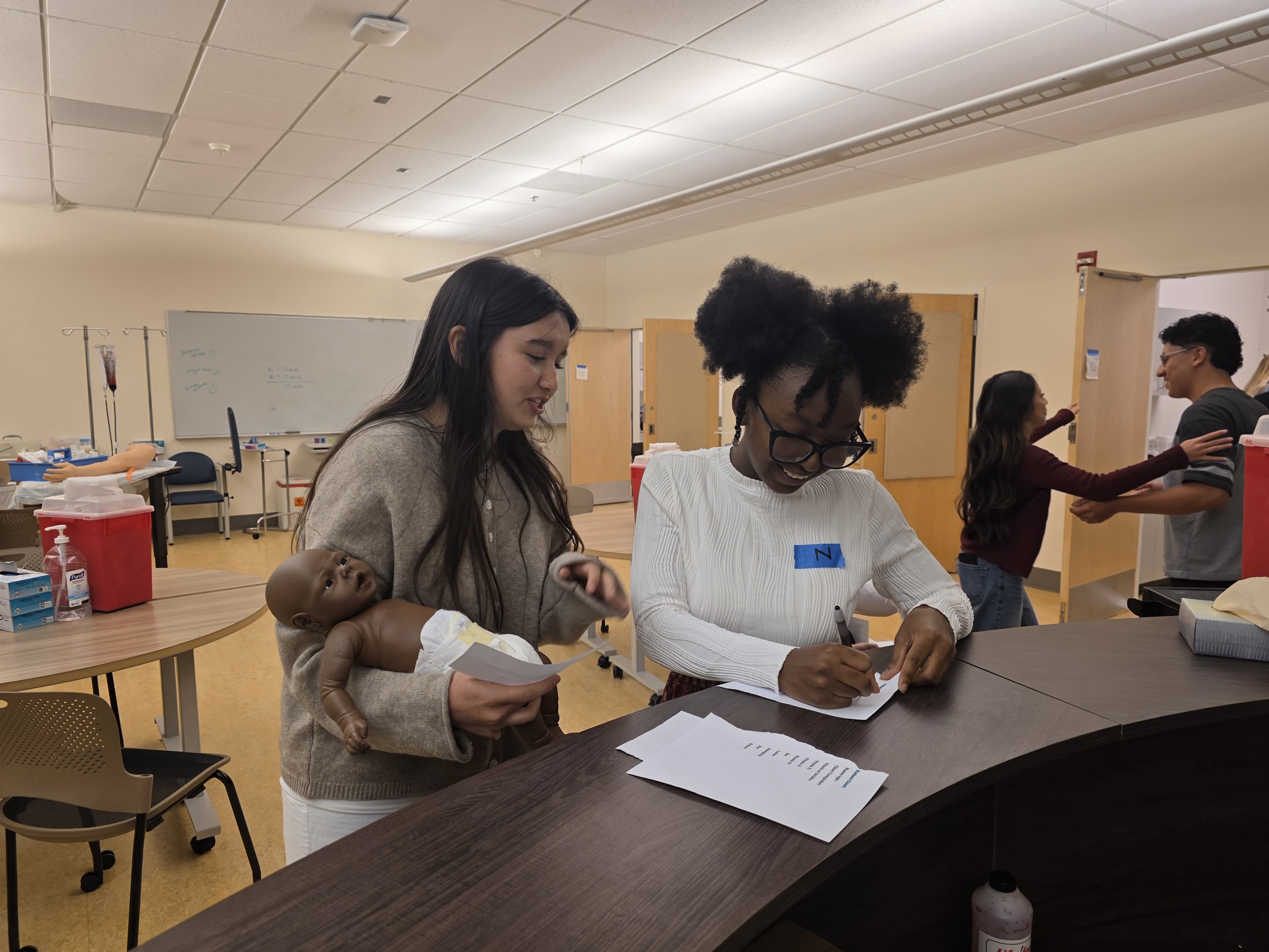Students participate in an emergency room simulation