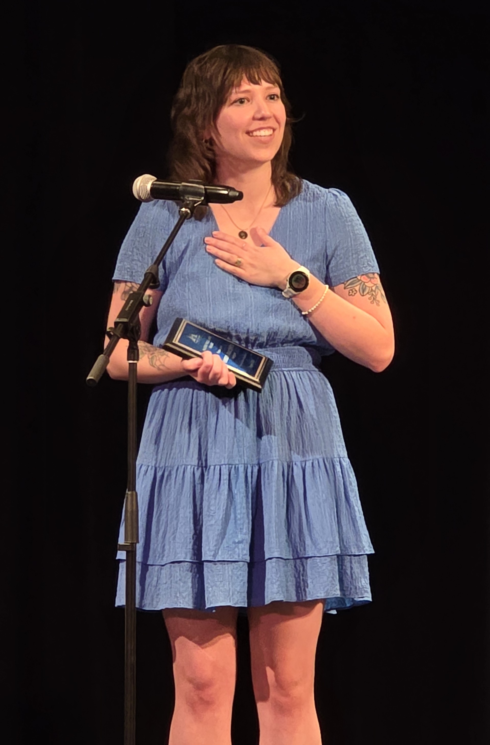 Amelia Haltiner holds the Maxine Williams award