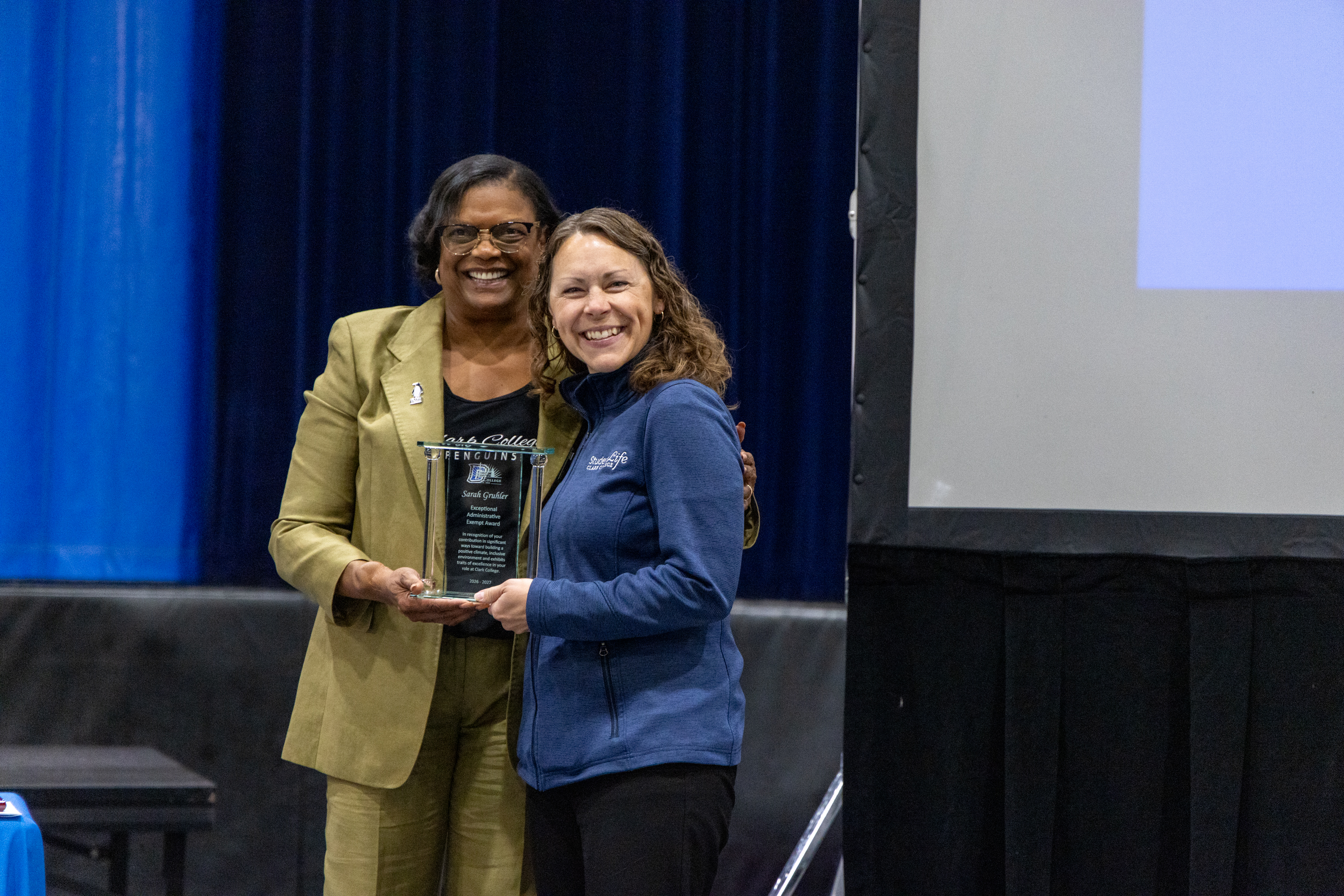 Dr. Edwards hands Sarah Gruhler her award