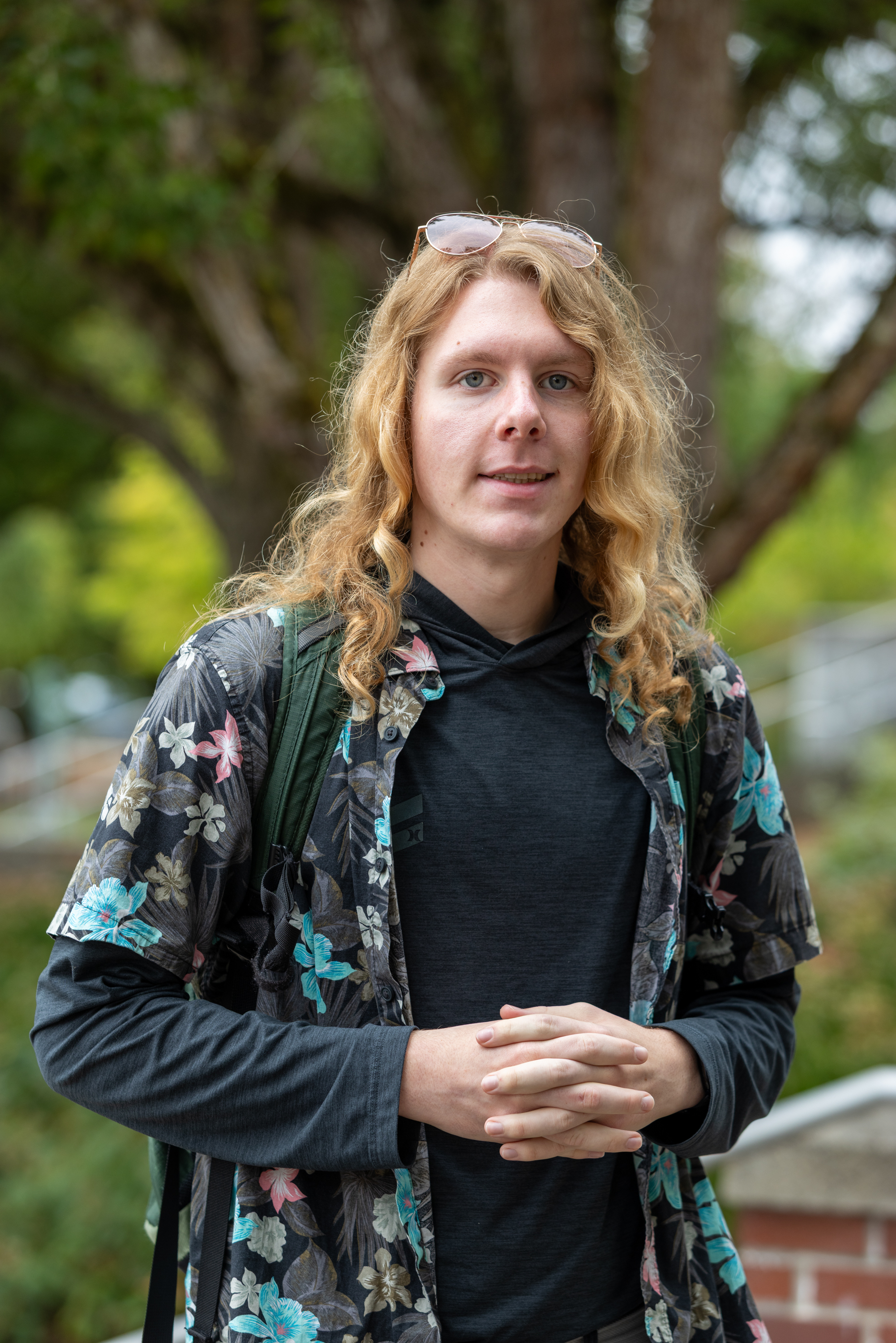 Student stands outside
