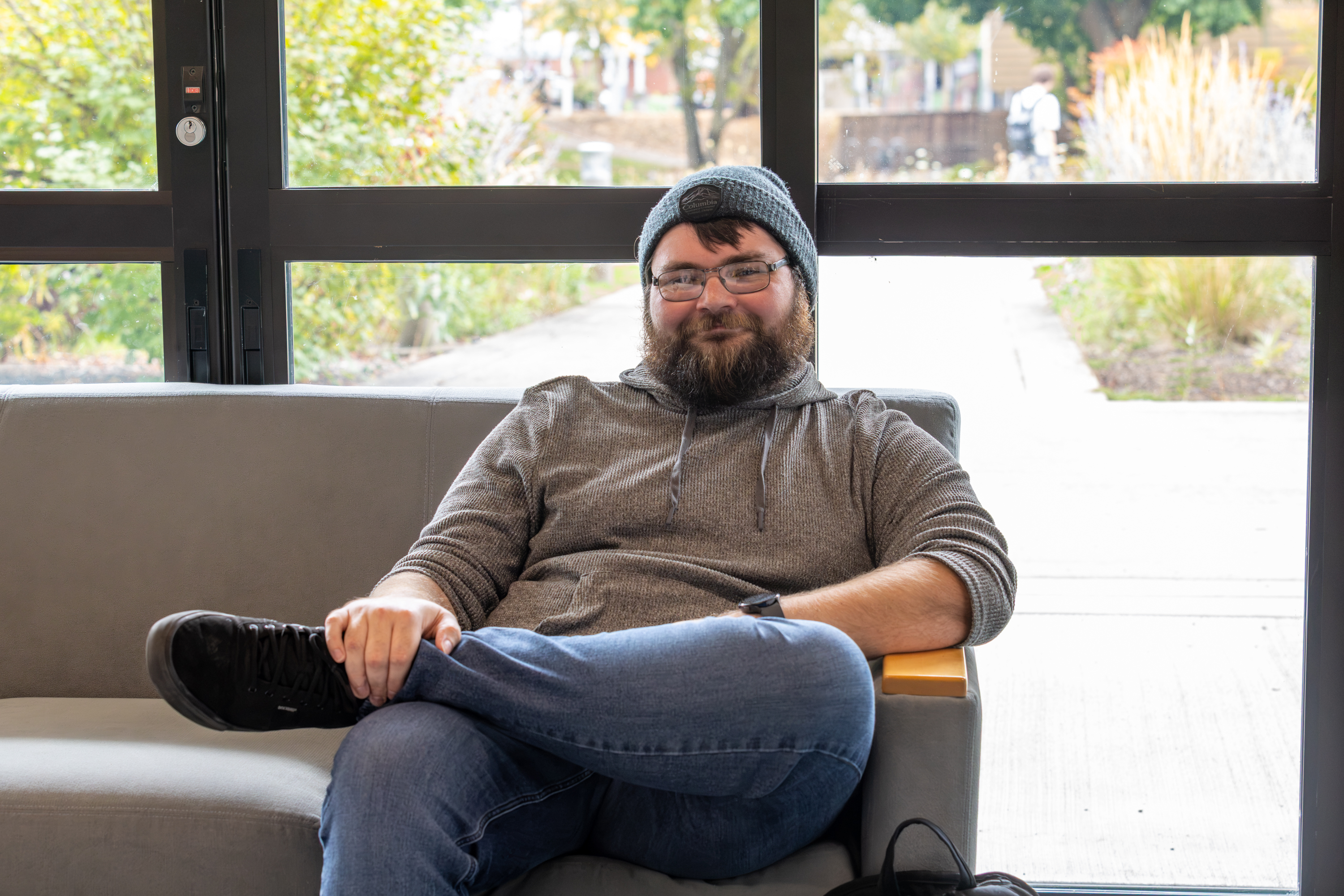 Student sits on a couch
