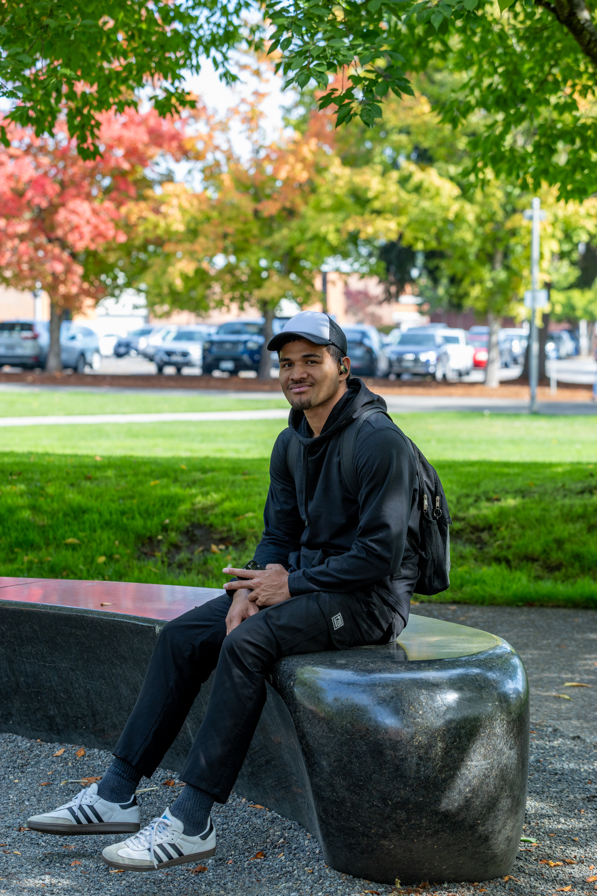 Student sits in Friendship Garden