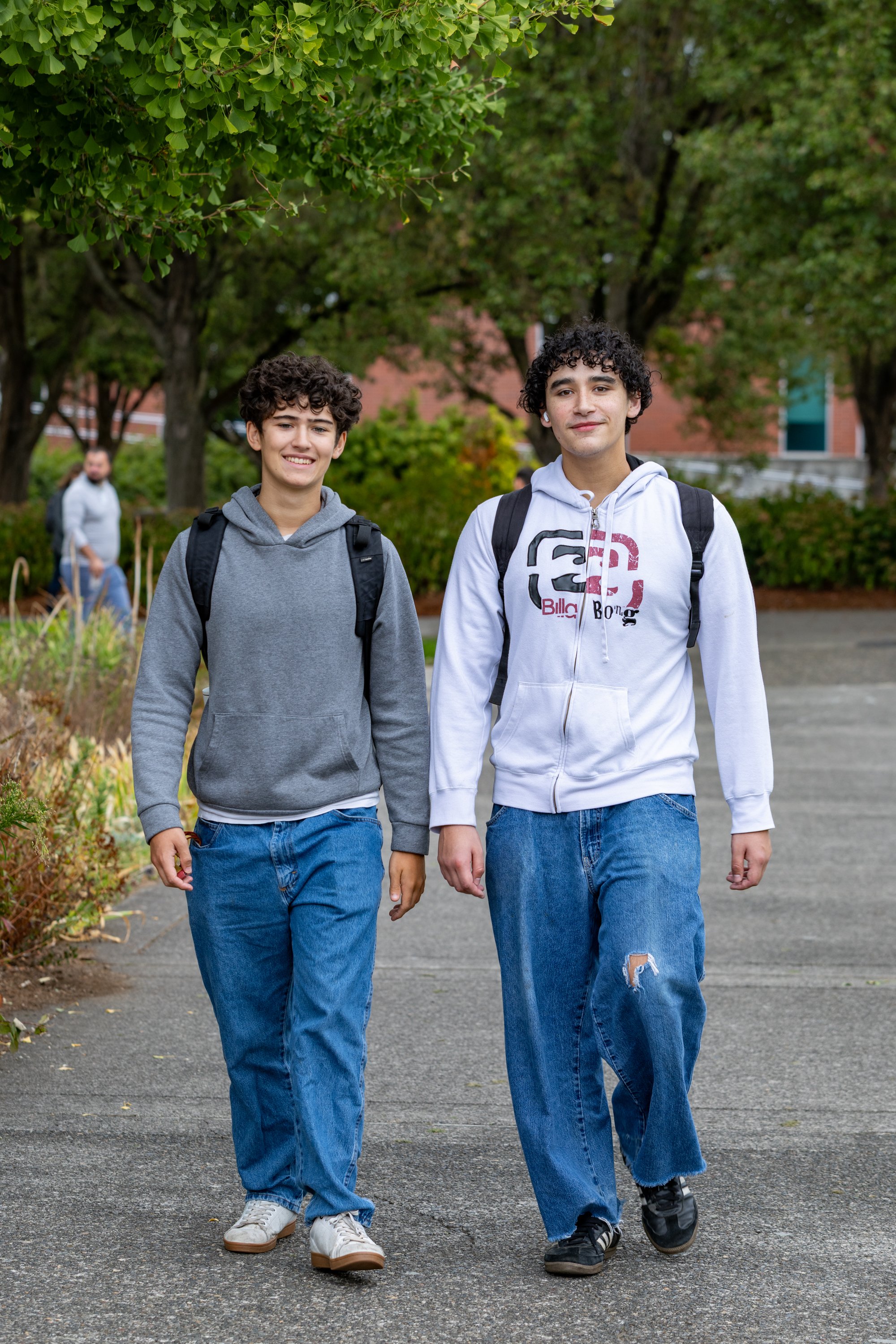 Two students walk together outside