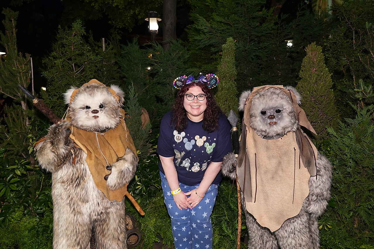 Laura wearing Mickey ears next to Star Wars characters