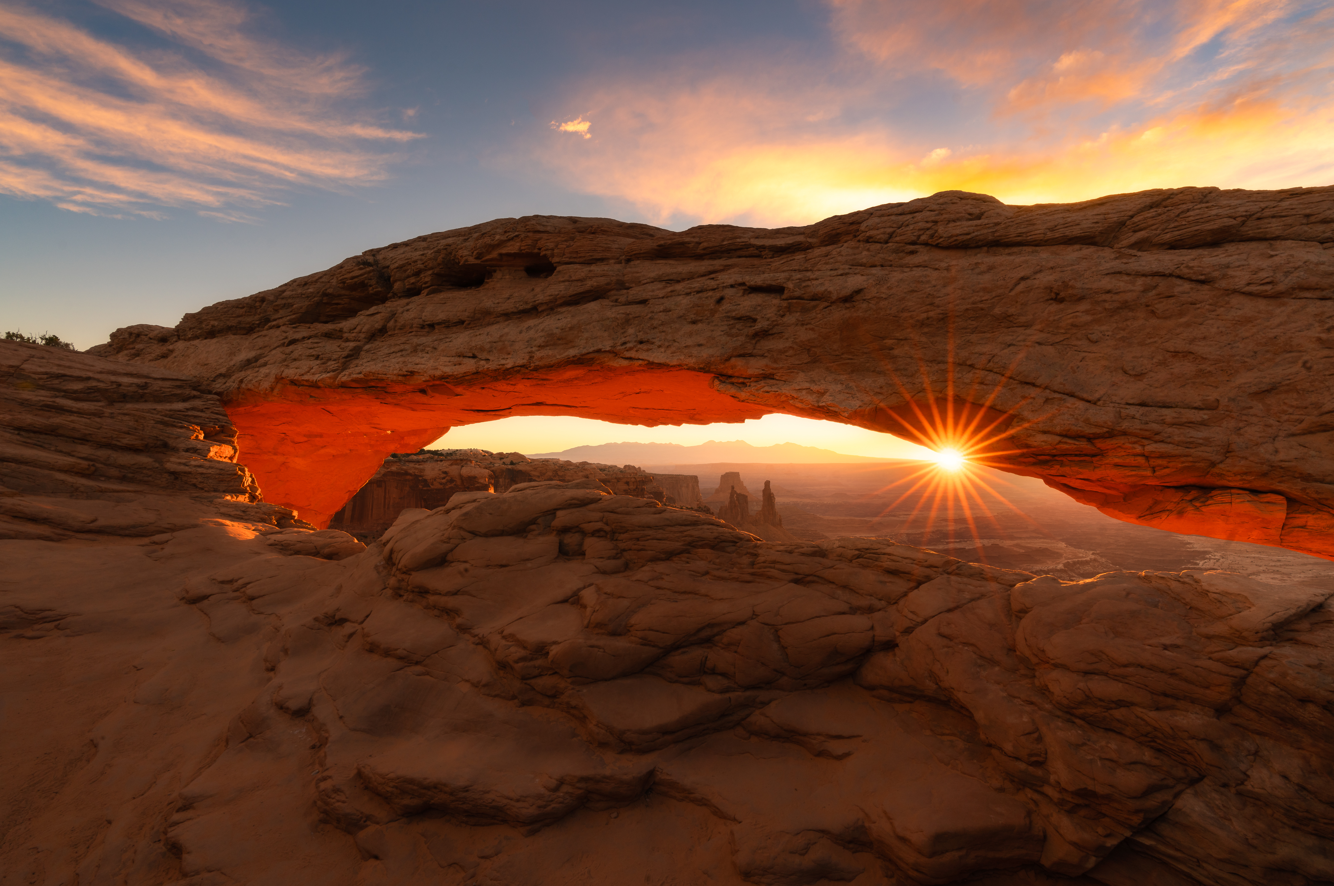 Landscape with sun setting in the background